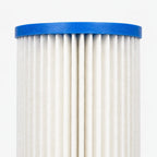 Close-up of the pleated cellulose media and blue vinyl plastisol end cap