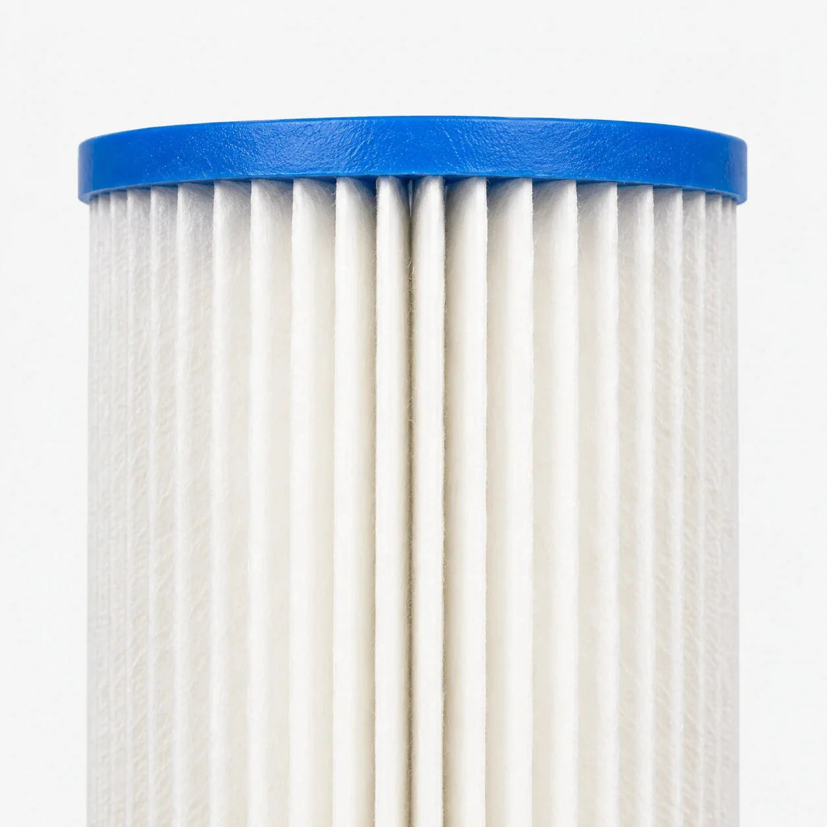 Close-up of the pleated cellulose media and blue vinyl plastisol end cap